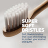 Replacement brush head with soft white bristles on bamboo handle