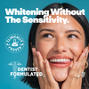 Woman smiling with "Whitening Without the Sensitivity" text above her