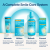 Lumineux Complete Smile Care System with toothpaste, strips, mouthwash, and pen on a blue background